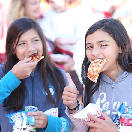Children eating Casey's Midwest Mystery Pizza