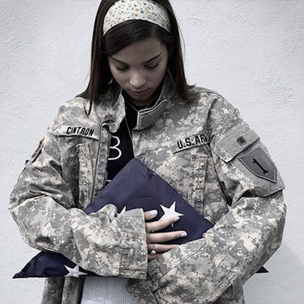 Adriana Paola Cintron Negron holding flag