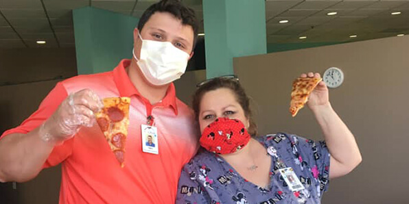 Healthcare workers with Casey's pizza