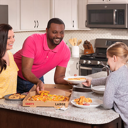 Family eating Casey's Pizza